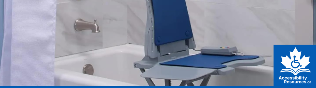 An accessibility device for bathing. A white plastic bath lift with a backrest is seated at the bottom of an empty bathtub, which can be raised and lowered to help a user get in and out safely.